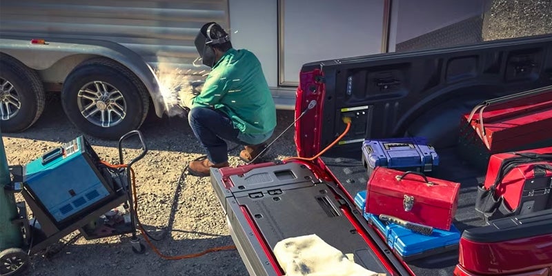 A Person Doing Welding Of A Vehicle